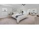 Serene main bedroom with tray ceilings, neutral tones, and a comfortable seating area at 1955 Pius Dr, Ellenwood, GA 30294