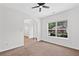 Bright home office featuring a large window and view into an open floor plan at 1955 Pius Dr, Ellenwood, GA 30294