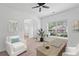 Bright home office featuring a large window, desk, and comfortable seating area at 1955 Pius Dr, Ellenwood, GA 30294