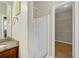 Bathroom with a glass door shower and an attached closet at 231 Yardsley Dr, Mcdonough, GA 30253