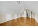 Bonus room featuring hardwood floors, with doors offering storage access, and recessed lighting at 231 Yardsley Dr, Mcdonough, GA 30253