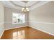 An empty dining room featuring hardwood floors and chair rail molding at 231 Yardsley Dr, Mcdonough, GA 30253