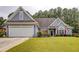 Charming single-Gathering home features a two-car garage, well-manicured lawn, and inviting curb appeal at 231 Yardsley Dr, Mcdonough, GA 30253