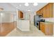 Open kitchen features stainless steel appliances, granite countertops, and wood cabinets at 231 Yardsley Dr, Mcdonough, GA 30253