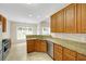 Kitchen with stainless steel appliances, wood cabinets, and granite countertops at 231 Yardsley Dr, Mcdonough, GA 30253