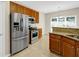 A kitchen featuring stainless steel appliances, granite countertops, and wood cabinets at 231 Yardsley Dr, Mcdonough, GA 30253