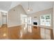 Spacious living area with hardwood floors, a fireplace, and a seamless transition to other living spaces at 231 Yardsley Dr, Mcdonough, GA 30253