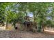 View of the deck overlooking the backyard, surrounded by mature trees at 286 Indian Trl, Marietta, GA 30068