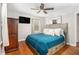 Cozy bedroom with hardwood floors, a ceiling fan, and lots of natural light at 286 Indian Trl, Marietta, GA 30068