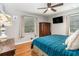 Cozy bedroom features hardwood floors, ample natural light, and a unique antique wardrobe at 286 Indian Trl, Marietta, GA 30068