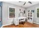 Bedroom with ample natural light featuring an organized desk, a window and hardwood floors at 286 Indian Trl, Marietta, GA 30068