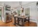 Eat-in dining area shows a wooden table, pendant lighting, and an open view to the kitchen at 286 Indian Trl, Marietta, GA 30068