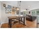 Eat-in dining area showcases an industrial-style table set and an array of framed pictures at 286 Indian Trl, Marietta, GA 30068