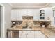 Charming kitchen with stainless steel appliances, white cabinetry, and modern countertops at 286 Indian Trl, Marietta, GA 30068