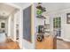 Corner view of a kitchen area with floating shelves, mirrored cabinet and view to back deck at 286 Indian Trl, Marietta, GA 30068