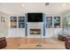 Inviting living room featuring a fireplace, built-in shelving, and beautiful hardwood floors at 286 Indian Trl, Marietta, GA 30068