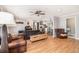 Spacious living room with hardwood floors, a ceiling fan, and comfortable leather seating at 286 Indian Trl, Marietta, GA 30068