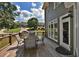 Relax on the back deck with outdoor seating and a view of the landscaped backyard at 6425 Riley Manor Way, Cumming, GA 30028