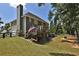 Back exterior view featuring deck, patio and fenced yard with lush lawn at 6425 Riley Manor Way, Cumming, GA 30028