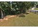 Large backyard with a baseball net, and mature landscaping at 6425 Riley Manor Way, Cumming, GA 30028