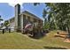 Back of house with deck, steps to yard, and an American flag at 6425 Riley Manor Way, Cumming, GA 30028