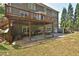 Large backyard features an elevated deck with covered patio, perfect for outdoor living at 6425 Riley Manor Way, Cumming, GA 30028
