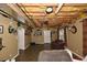 Spacious finished basement with drop ceiling, tile floors, and ample storage space at 6425 Riley Manor Way, Cumming, GA 30028