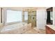 Bathroom with tub, glass enclosed shower and tile flooring at 6425 Riley Manor Way, Cumming, GA 30028