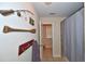 Bathroom with a vanity, shower/tub with gray shower curtain, and decorative fishing-themed decor at 6425 Riley Manor Way, Cumming, GA 30028