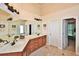 Bathroom features double sinks, tile floors, and white cabinets at 6425 Riley Manor Way, Cumming, GA 30028