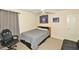 Cozy bedroom features neutral walls, plush carpet, and ceiling fan at 6425 Riley Manor Way, Cumming, GA 30028