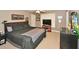 Bedroom with ceiling fan, TV, and dresser offers a comfortable space for relaxation at 6425 Riley Manor Way, Cumming, GA 30028