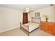 Inviting bedroom with neutral walls, carpeted floor, and natural light at 6425 Riley Manor Way, Cumming, GA 30028