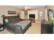 Bedroom with a ceiling fan, carpet, and an accent wall with a wooden headboard at 6425 Riley Manor Way, Cumming, GA 30028
