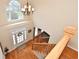 Bright foyer with hardwood floors, staircase, and chandelier at 6425 Riley Manor Way, Cumming, GA 30028