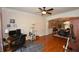 Living room featuring hardwood floors and an open floor plan at 6425 Riley Manor Way, Cumming, GA 30028