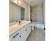 Stylish bathroom featuring tiled shower/tub and modern fixtures, complemented by natural light at 115 Palisade Dr, Rydal, GA 30171