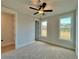 Cozy bedroom with plush carpet, natural light, and neutral color palette, inviting comfort at 115 Palisade Dr, Rydal, GA 30171