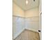 This walk-in closet features wire shelving and carpeted floors for efficiently organized storage at 115 Palisade Dr, Rydal, GA 30171