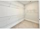 Walk-in closet featuring carpeted flooring and wire shelving at 115 Palisade Dr, Rydal, GA 30171