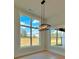 Bright dining area featuring expansive windows with a modern pendant light at 115 Palisade Dr, Rydal, GA 30171
