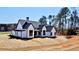 Beautiful two-story home with a classic design and lush green surroundings at 115 Palisade Dr, Rydal, GA 30171