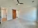 Light-filled main bedroom boasts shiplap wall, vaulted ceiling, and a rustic barn door to the bathroom at 115 Palisade Dr, Rydal, GA 30171