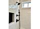 This shower features sleek black fixtures, a built-in niche, and bright white subway tile at 115 Palisade Dr, Rydal, GA 30171