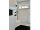 This shower features sleek black fixtures, a built-in niche, and bright white subway tile at 115 Palisade Dr, Rydal, GA 30171