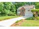 Charming two-story home with a brick facade, complemented by a well-manicured lawn and lush greenery at 190 Crestworth Ct, Powder Springs, GA 30127