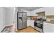 Modern kitchen with stainless steel appliances, white cabinets, and granite countertops at 190 Crestworth Ct, Powder Springs, GA 30127