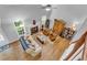 A birds eye view of the living room, complete with fireplace, wood floors, and comfortable seating at 190 Crestworth Ct, Powder Springs, GA 30127