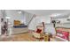 Cozy living room with hardwood floors, a fireplace, and an open floor plan connecting to the kitchen at 190 Crestworth Ct, Powder Springs, GA 30127