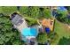Aerial view of the sparkling community pool and splashpad with an adjacent playground at 365 Falling Creek Bnd, Duluth, GA 30097